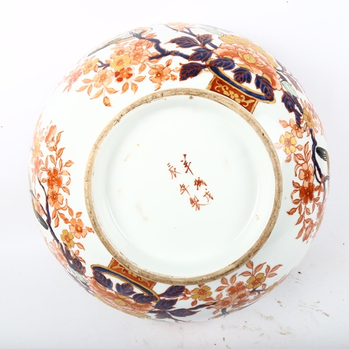 703 - A Chinese porcelain bowl with floral decoration, 6 character mark, 40cm across