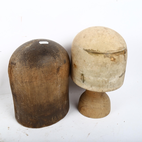 827 - A wooden hat block on stand, and another without stand