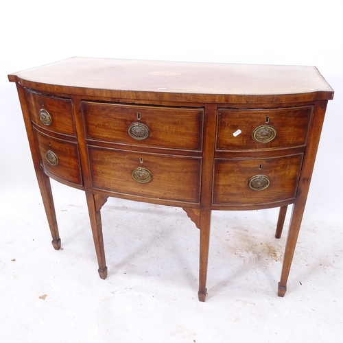 2287 - A George III crossbanded mahogany bow-front sideboard, with fitted drawers and cupboards, on square ... 