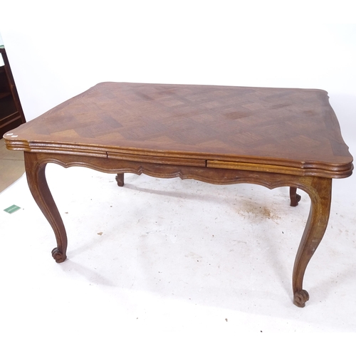 2288 - A French oak parquetry-topped draw leaf dining table, L140cm, H75cm, D100cm