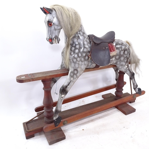 2290 - A composite dapple grey rocking horse with saddle, on stained pine folding base, L128cm, H102cm