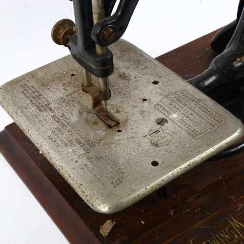 524 - A Vintage Willcox & Gibbs sewing machine