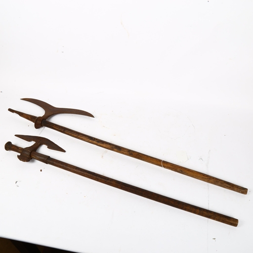 476 - 2 iron-headed war axes, largest overall length 83cm (2)