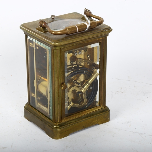 482 - A brass repeating carriage clock, white enamel dial with Roman numeral hour markers and movement str... 