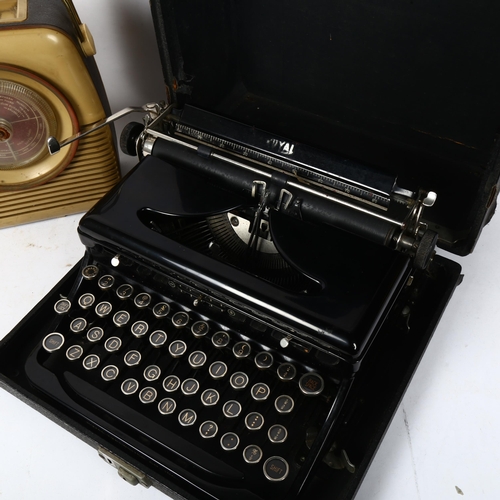 495 - Cased Royal typewriter, and Bush battery operated radio (2)