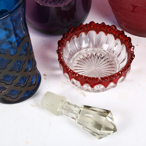 856 - Art glass amethyst decanter and stopper, 43cm, a metal-clad blue glass mug, 2 red glass vases etc