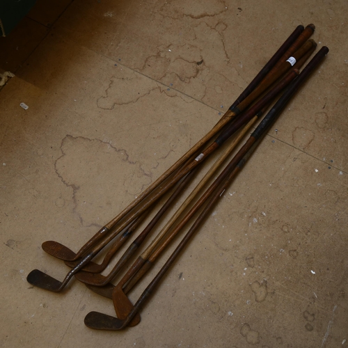 862 - 7 Antique wooden-shafted golf clubs