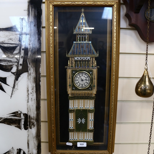 908 - A decorative wall clock in glazed case, height 64cm