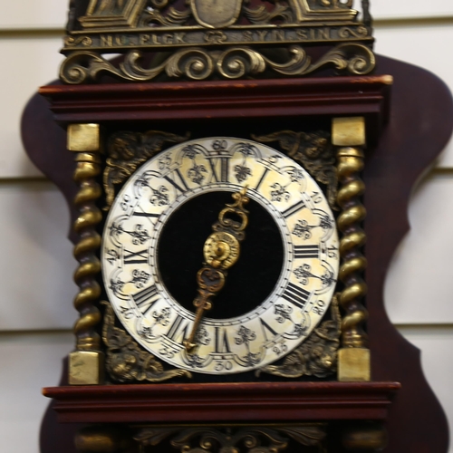 909 - A reproduction brass-mounted wall clock