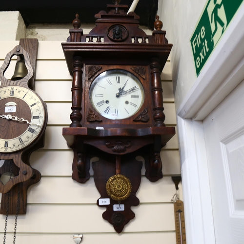 914 - A 1920s oak-cased 8-day wall clock, with pendulum, length 95cm, working order