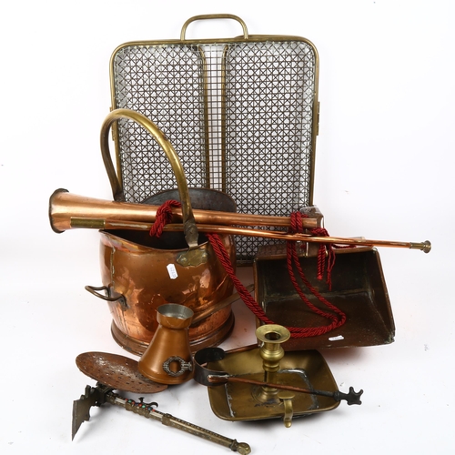 919 - A copper coal bucket, a brass-framed mesh fireguard, copper horn etc