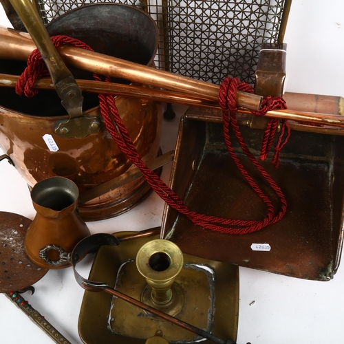 919 - A copper coal bucket, a brass-framed mesh fireguard, copper horn etc