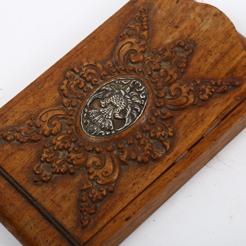 946 - A German carved oak visiting card case, with white metal bird plaque, length 14cm