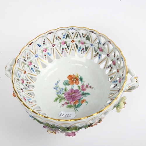 954 - A 19th century Dresden hand painted and gilded porcelain basket, diameter 17cm