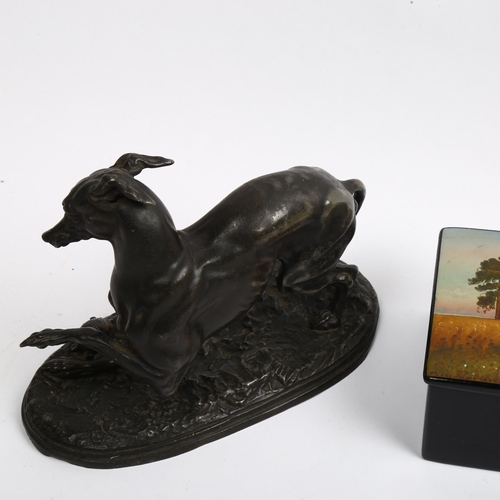 968 - A patinated spelter Greyhound sculpture, and a Russian black lacquer palekh box (2)