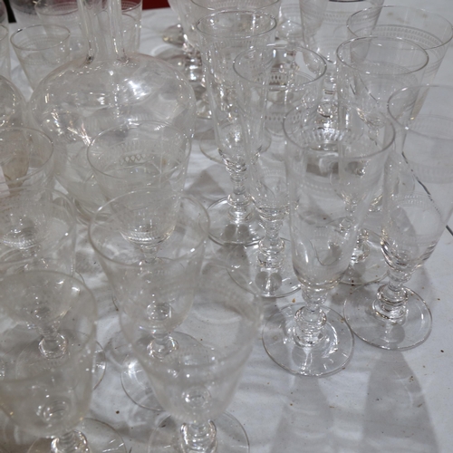 993 - A suite of Edwardian etched glasses, including wine, Champagne and Sherry, and 4 matching glass deca... 