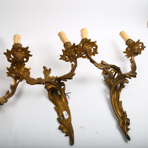 995 - A set of 4 gilt-brass twin wall lights, with foliate design, height 40cm