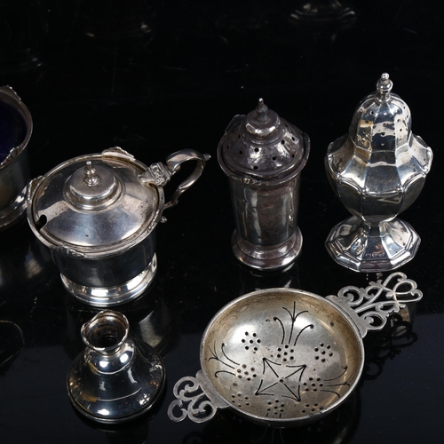 1071 - An Elizabeth II silver tea strainer, silver cruets, pepperette etc