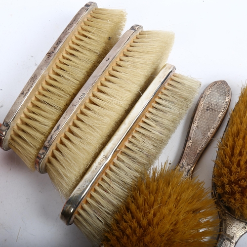 1081 - A 4-piece silver-backed dressing table set, and another similar silver clothes brush (5)