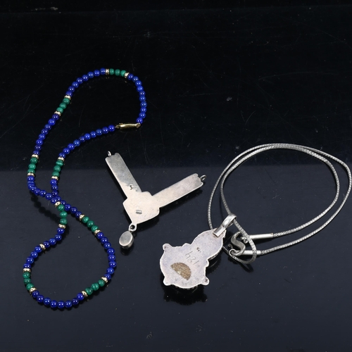 1131 - A 9ct gold lapis and malachite bead necklace, silver and lapis pendant necklace, and another (3)