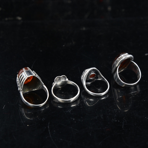 1132 - 4 silver and amber rings