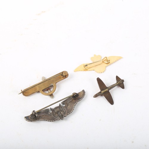 318 - A Second World War Period US Airforce aerial gunner wings brooch, similar propeller and wings brooch... 