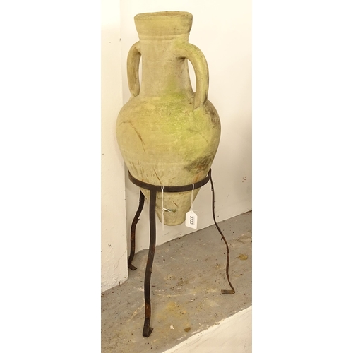 2722 - A 2-handled terracotta amphora on stand