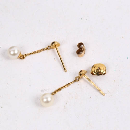 1161 - A pair of unmarked gold pearl drop earrings