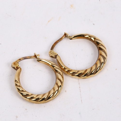 1162 - A pair of 9ct gold hoop earrings