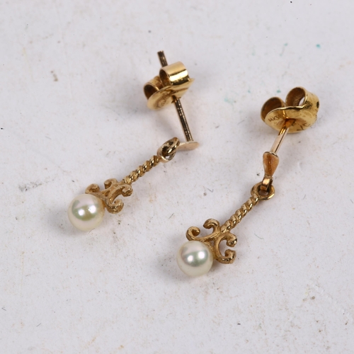 1163 - A pair of unmarked gold pearl drop earrings