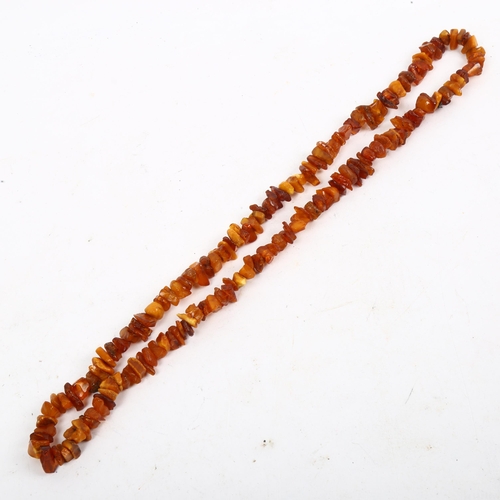 1202 - A specimen amber bead necklace