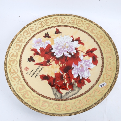 462 - A Chinese glazed ceramic charger, with floral decoration, W41cm