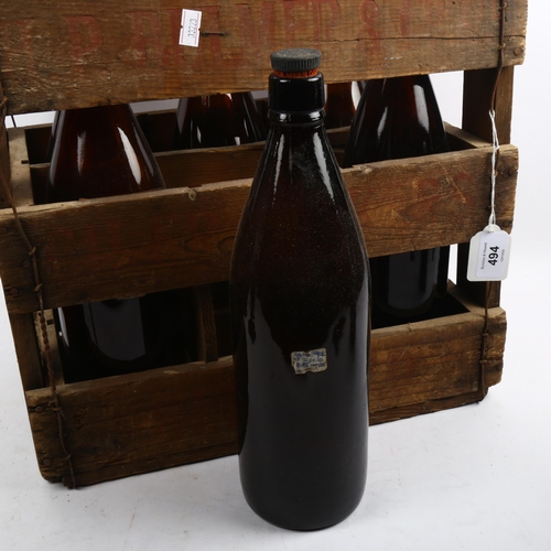 494 - An early 20th century pine crate with 6 bottles