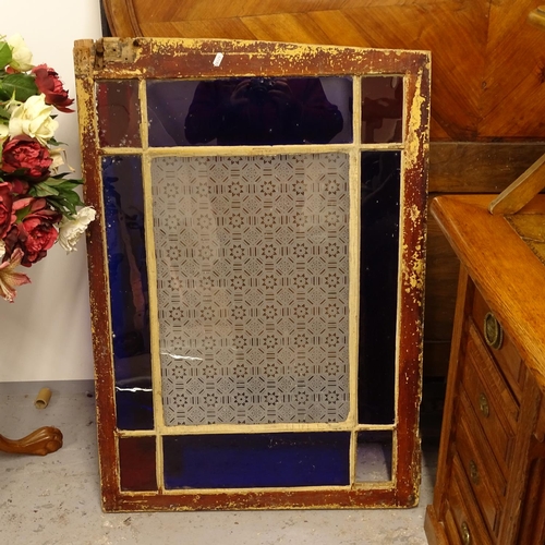 2669 - A coloured glass window pane, width including frame 69cm