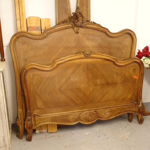 2672 - A French carved and panelled walnut 4'6