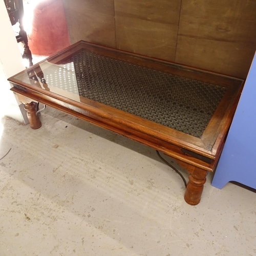 2686 - An Indonesian hardwood coffee table, with inset chainmail panel and glass top, L134cm, H42cm, D75cm