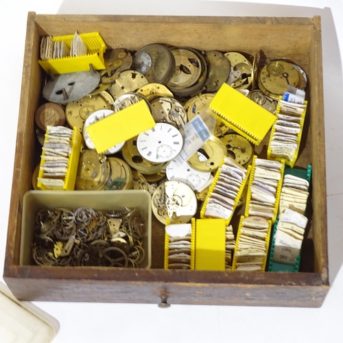 1107 - A Vintage watchmaker's table-top chest of drawers, containing a large quantity of various parts and ... 