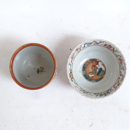 276 - A Chinese famille rose hand painted enamelled porcelain carp bowl, a small Japanese kutani beaker, l... 