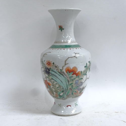 359 - A Chinese famille verte porcelain baluster vase, hand painted floral decoration, height 24cm, on har... 