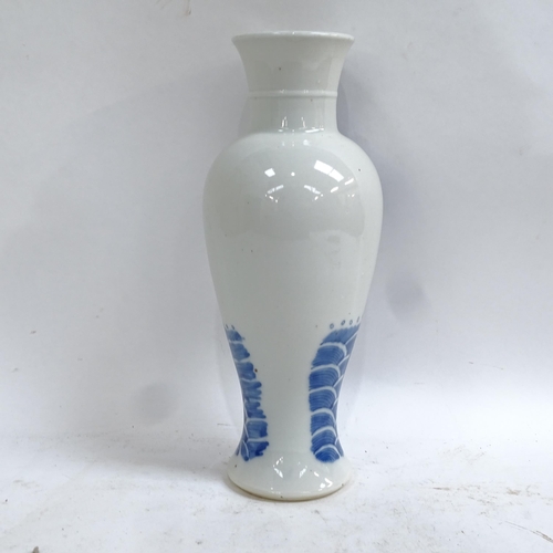 360 - A Chinese blue and white 'Temple' baluster vase, 4 character mark on base, height 29cm