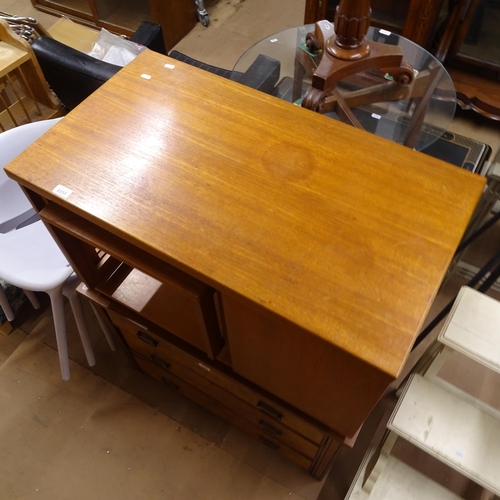 2233 - An unusual mid-century teak coffee table, with fold over top, integrated nest of 2 tables, and a dro... 