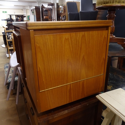 2233 - An unusual mid-century teak coffee table, with fold over top, integrated nest of 2 tables, and a dro... 