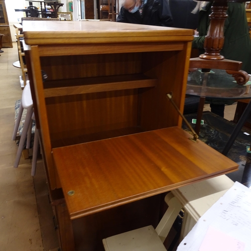 2233 - An unusual mid-century teak coffee table, with fold over top, integrated nest of 2 tables, and a dro... 