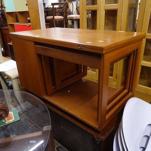 2233 - An unusual mid-century teak coffee table, with fold over top, integrated nest of 2 tables, and a dro... 