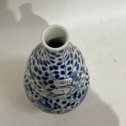 363 - A Chinese blue and white double-gourd vase, figural and floral decoration with jars, height 29cm