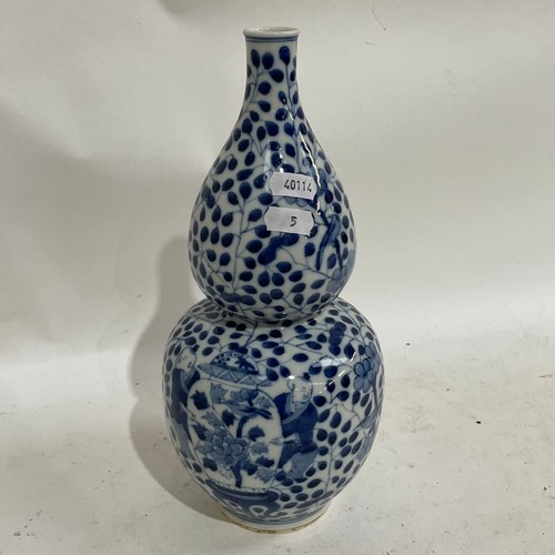 363 - A Chinese blue and white double-gourd vase, figural and floral decoration with jars, height 29cm