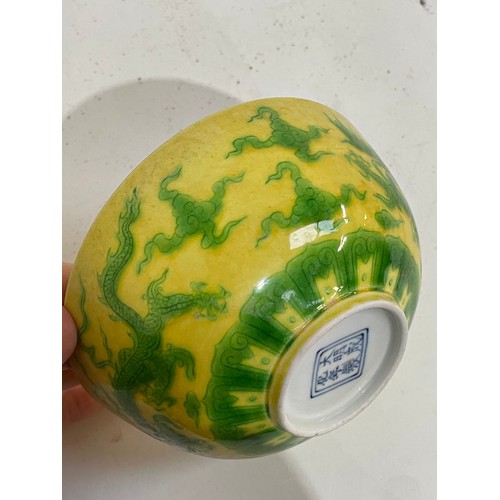 282 - A Chinese yellow ground green glaze 'dragon' bowl, 6 character mark, diameter 12cm