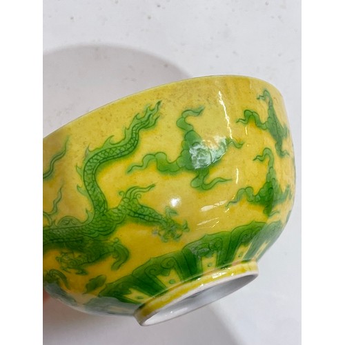 282 - A Chinese yellow ground green glaze 'dragon' bowl, 6 character mark, diameter 12cm