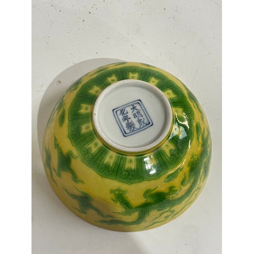 282 - A Chinese yellow ground green glaze 'dragon' bowl, 6 character mark, diameter 12cm