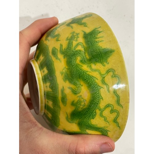 282 - A Chinese yellow ground green glaze 'dragon' bowl, 6 character mark, diameter 12cm